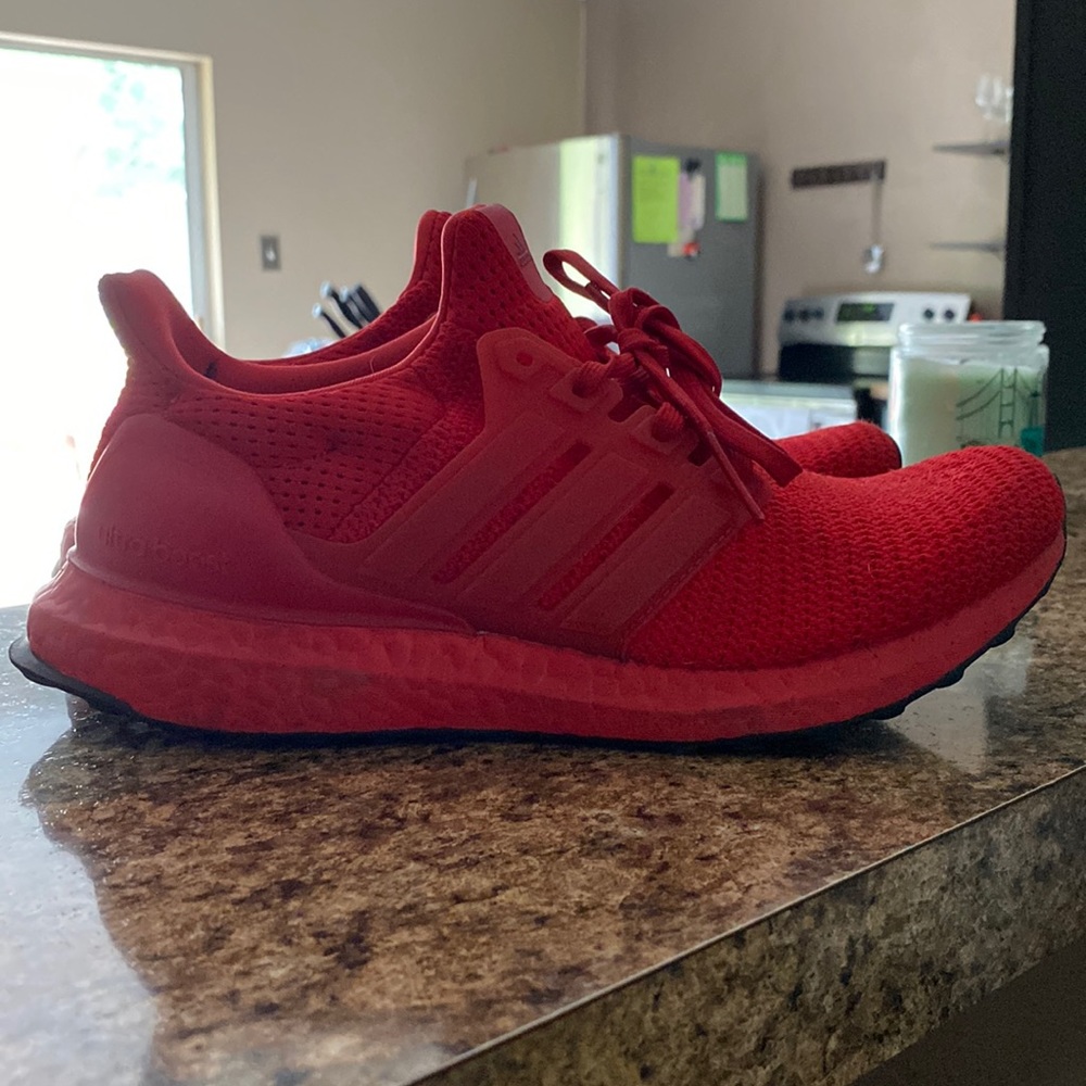 Red Adidas BOOST running shoes